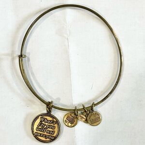 Gold Alex and Ani charm bracelet what's for you will not pass you